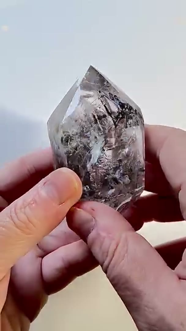 Clear quartz with falling carbon and enhydro inclusions, often referred to…