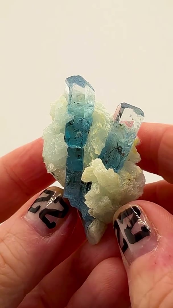 A perfectly balanced pair of gemmy aquamarine crystals