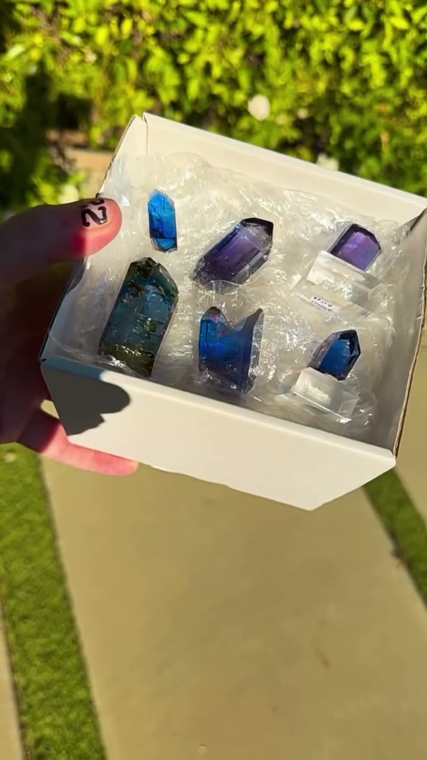 Six natural, unheated Tanzanite beauties soaking up the sunlight and putting…